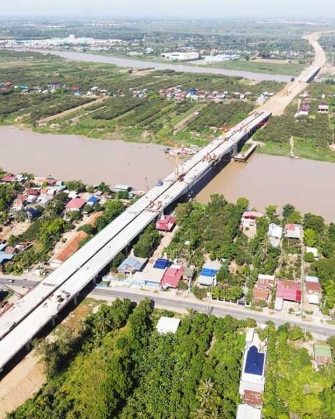 Aerial view of the Stung Trang-Kroch Chhmar Cambodia-China Friendship Bridge spanning a river in Cambodia.