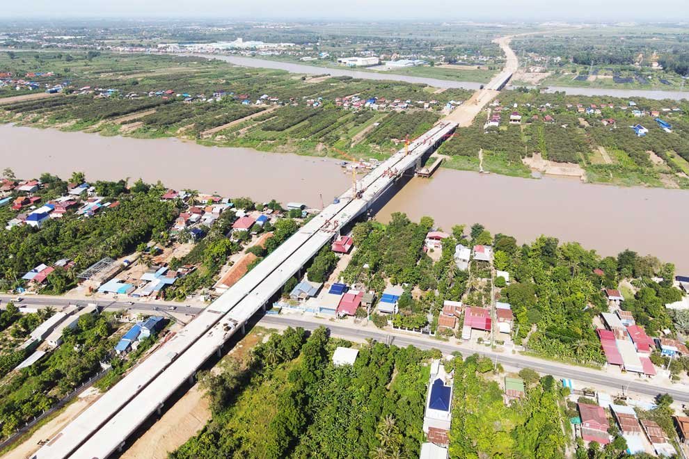 Aerial view of the Stung Trang-Kroch Chhmar Cambodia-China Friendship Bridge spanning a river in Cambodia.