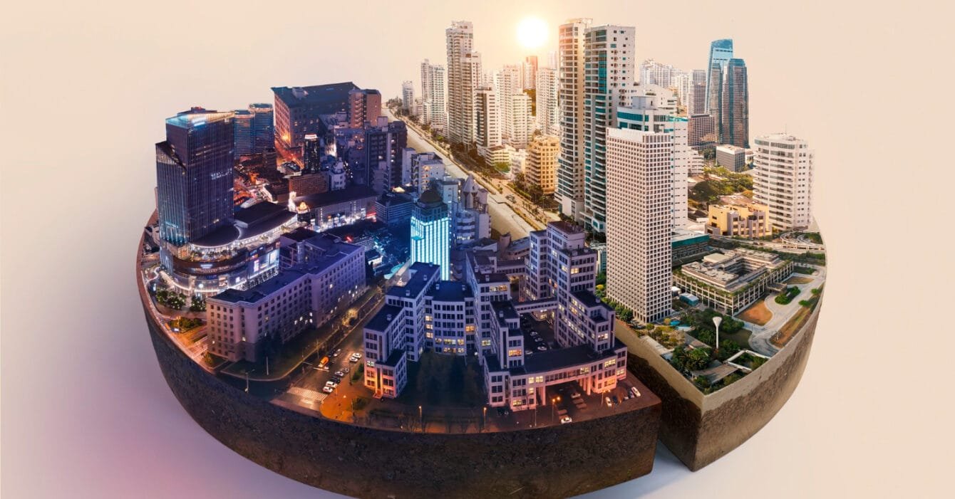 Cambodia Smart City Projects: A cityscape at sunset with buildings on a curved surface against a white background.