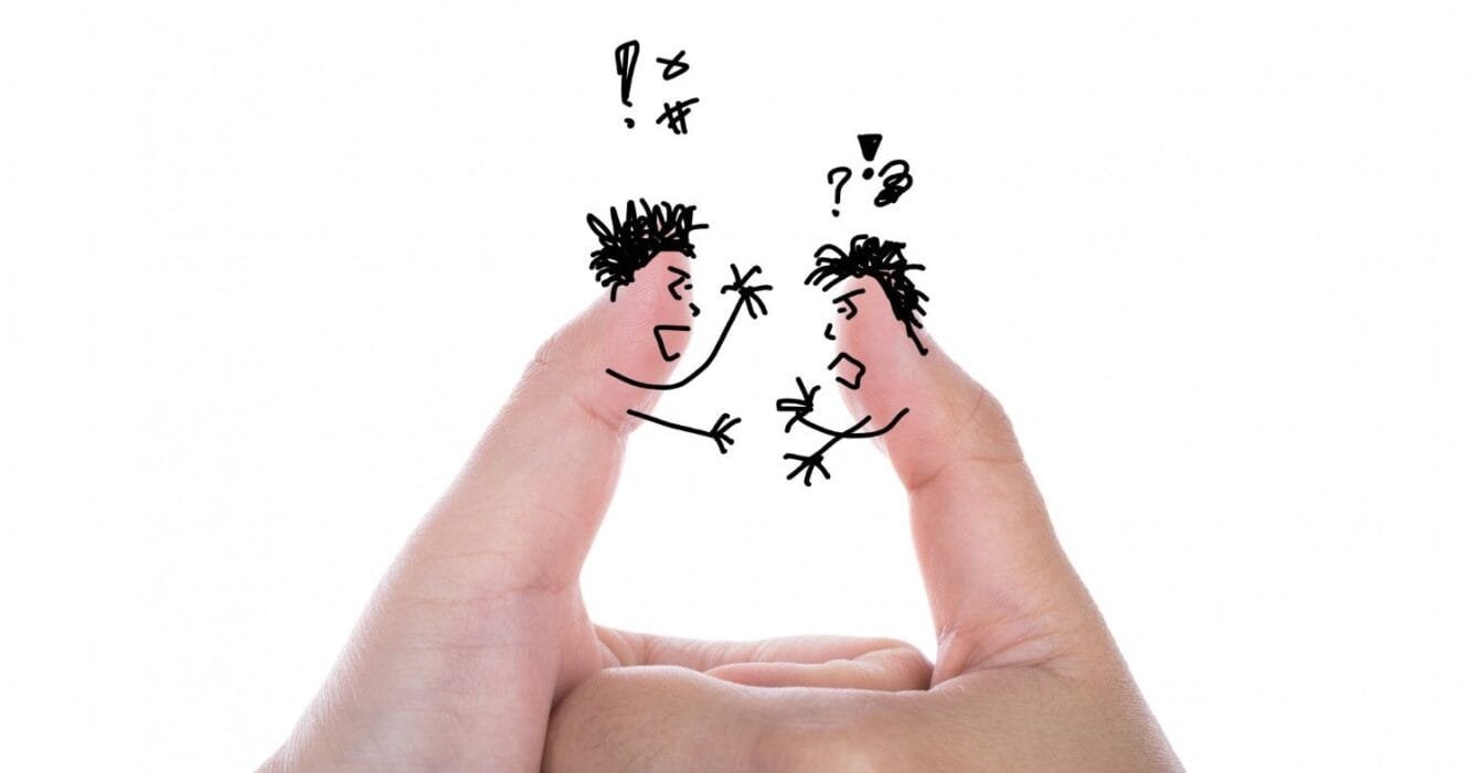 2045 Cambodia Border Trade Tensions: Two fingers artfully drawn as angry characters facing each other, conveying a playful argument with speech bubbles and expressive gestures.