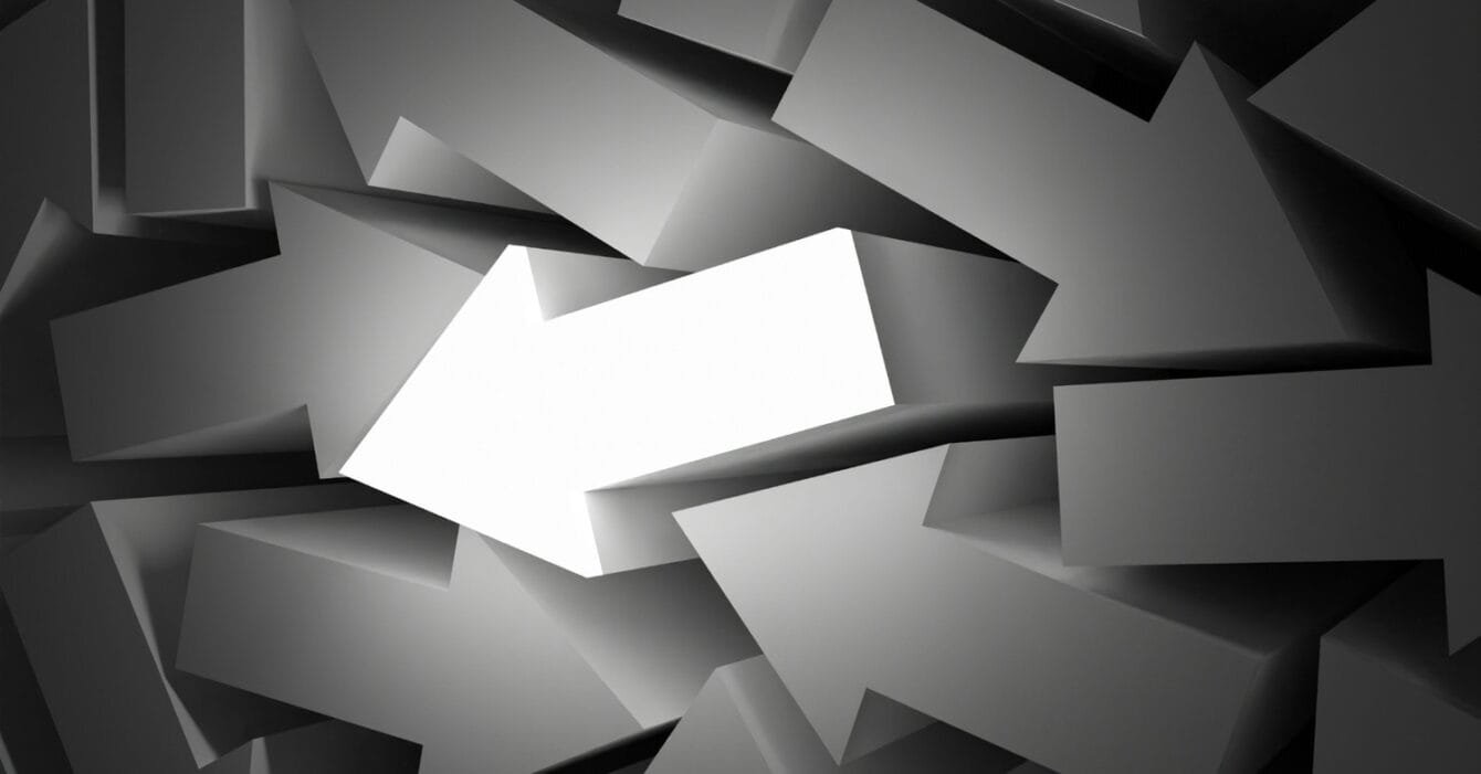 Cambodia's economic diversification: A standout white arrow among overlapping gray arrows, symbolizing direction and focus amid confusion.